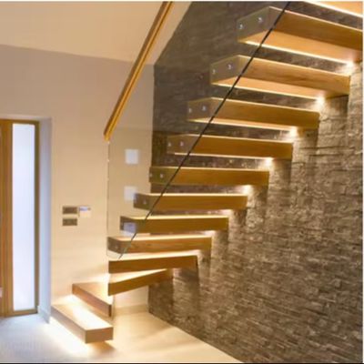 Escalier flottant à LED solide et personnalisé avec poutre d'acier cachée et garde-corps en verre